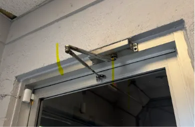 Technician checking commercial access control hardware